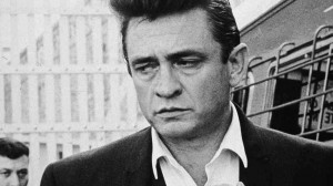 Johnny Cash walks inside the gates of Folsom Prison, preparing to ...
