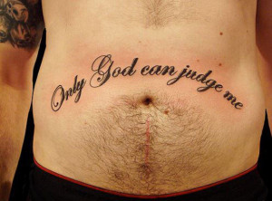 The famous phrase only God can judge me, in tattoo lettering.