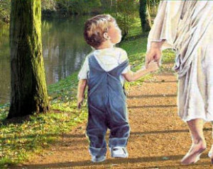 Boy walking and holding hands with Jesus.