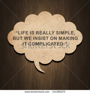 by Confucius on speech bubble paper on wood background - stock photo ...
