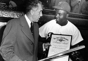 Ford Frick, president of the National League, presents a silver bat ...