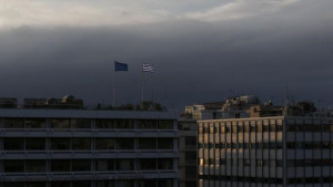 flag (R) and a European Union flag flutter atop the Finance Ministry ...