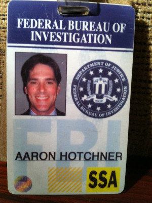 Hotch's ID, which contains a rare instance of him smiling.
