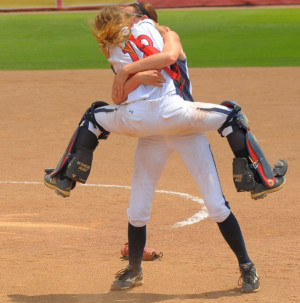 Catcher Elisa Orlandi leaps into the arms of battery mate Kaitlyn ...