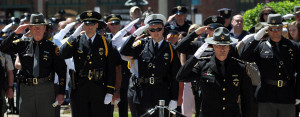 police and law enforcement officers from around the area salute during ...