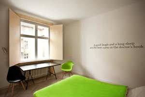 polish apt bedroom with quote on wall