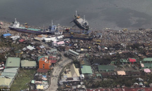Ships that washed ashore into a coastal community after Typhoon Haiyan ...