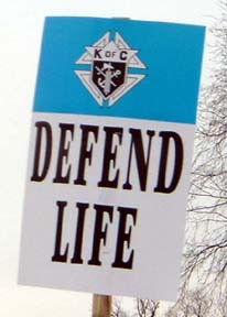 photograph of a placard at the March of Life that reads defend life ...
