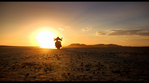 Motorcycle Riding Off Into Sunset