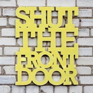 typographic wall decor with a clear message: Shut the front door .