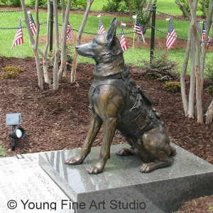 the statue depicts a life size belgian malinois wearing his full