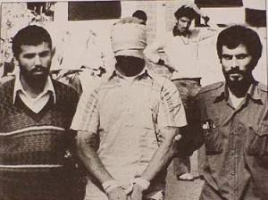 hostage escorted by two Iranian students in 1976.