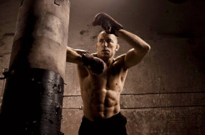 UFC champion Georges St-Pierre, or GSP, shows off his rock-hard abs ...
