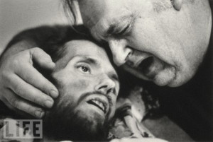 Bill Kirby tries to comfort his dying son, David, an AIDS patient ...