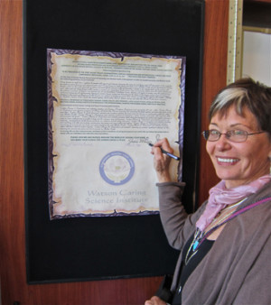 Jean signing the International Charter for Human Caring Jean ...