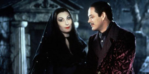Description: Angelica Huston as Morticia Addams offers comfort to her ...