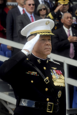 The Commandant of the Marine Corps, General James F. Amos saluting