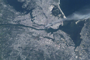 Visible from space, a smoke plume rises from the Manhattan area after ...
