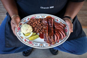 Preacher/pitmaster Reverend Clinton Edison with a two-meat plate at ...