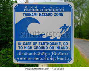 Tsunami zone Sign in Thai and English - stock photo