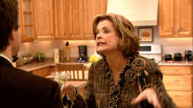 Lucille Bluth using air quotes while drunk and holding alcohol in ...