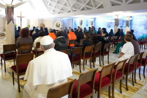 Pope Francis sits in the last seat while praying in the St. Martha ...