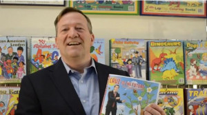 ... Books Publisher Wayne Bell holding up the Ted Cruz coloring book
