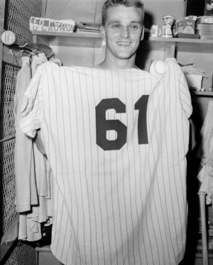 Roger Maris holds Yankee uniform 61 after his historic feat. Maris ...