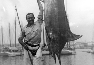 Ernest Hemingway loved the hunt. Here he stands beside a marlin he ...