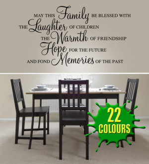 Black May this family be blessed wall decal beside a dining table