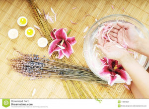 Hand and nail spa and beauty treatment with aroma and flowers in water ...