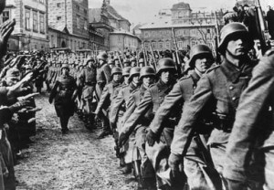 Steel helmeted German troops marching into Prague during the invasion ...