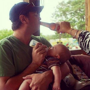 ... Jay Cutler feeding his son, while someone is feeding him a beer