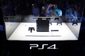Visitors take pictures of Sony's PlayStation 4 new game console at the ...