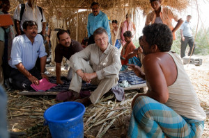 Bill Gates meets with a farmer in the Indian village of Guleria in May ...