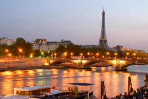 See Paris by night from the Seine