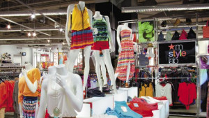 shows a clothing display which is part of Macy’s Millennial strategy ...