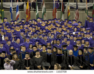 college graduation crowd with one member wearing funny nose glasses