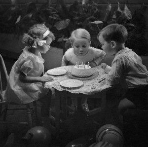 Children blowing out candles on birthday cake way back in 1934 - some ...