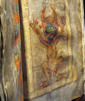 Devil’s Bible Photo open on the page of the picture showing Satan ...