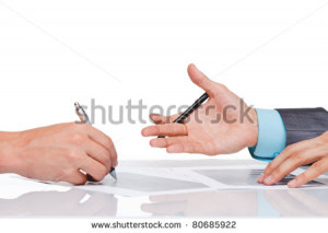 Hands of business people in elegant suits sitting at desk working in ...