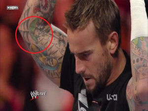 Cm punk gets a tattoo of lita on his arm