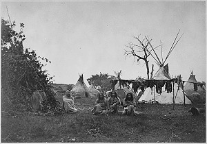 Arapaho camp with buffalo meat drying near Fort Dodge, Kansas , 1870