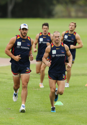 Scott Thompson Taylor Walker and Scott Thompson run during a Adelaide