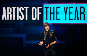 Artist of the Year award onstage during the 2010 American Music Awards ...