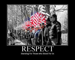 Veterans holding USA flags in a line formation