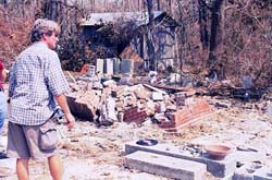 John Anderson, youngest son of Walter Anderson, surveying the damage ...