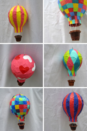 Paper mache a balloon, pop the balloon, add string and a basket for ...