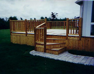 Porch, stairs and patio style deck complete with railed-in corner and ...