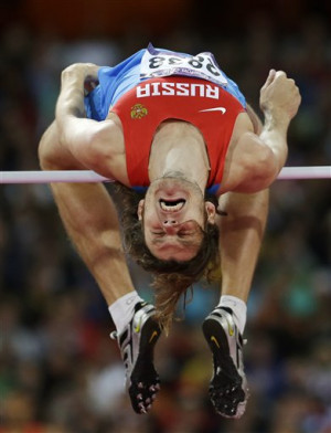 Russia's Ivan Ukhov clears the bar in the men's high jump final during ...
